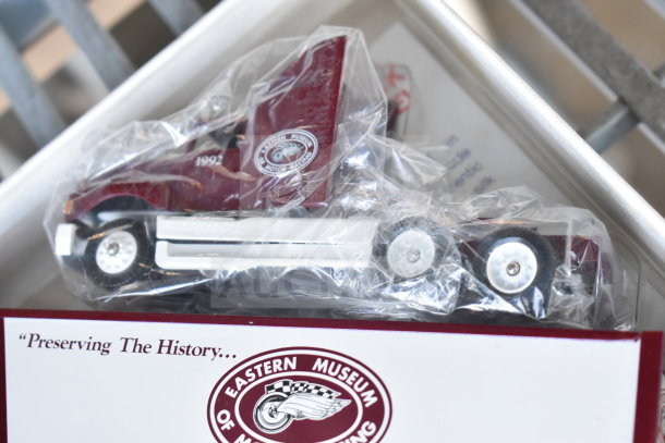 Winross Truck model in box, maroon cab with 1992 marking, Eastern Museum of Motor Racing logo, preserved in plastic wrap.