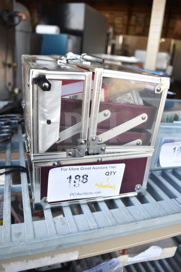 Transparent case containing various necklaces and bracelets, labeled "188" with auction site URL.