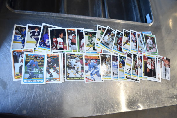 Lot of various ice hockey trading cards, including players from teams like the Flyers, Nordiques, and Islanders, in good condition.