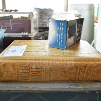 Holy Bible Master Reference Edition with embossed cover, alongside Kozo FM/AM World Band Receiver in box. Auction label shows lot info.