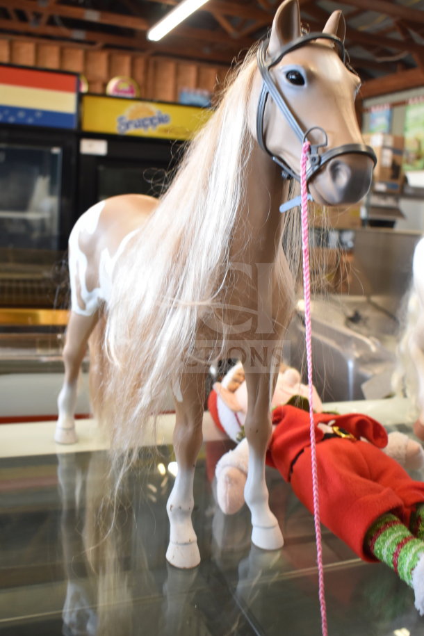 Lot of toys including a detailed play horse with a bridle, a plush turtle, and an elf doll. Good condition.