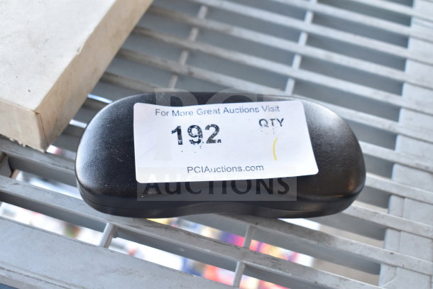 Black hard glasses case with auction label showing number 192, indicating auction details and website link.