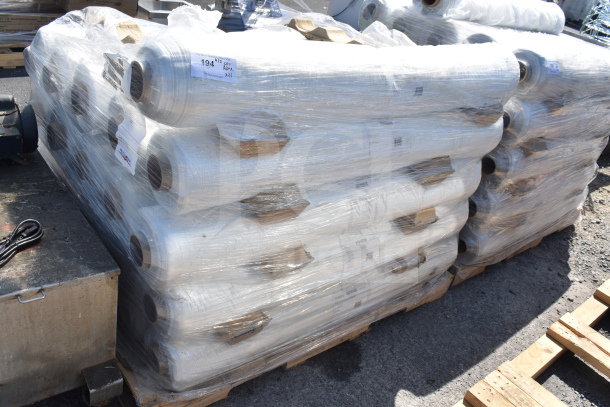 Stacked rolls of 21 FG-W0005-04 Stretch Film, bagged in plastic. Roll size 52,44,70; 150/roll. Auction lot of 21 rolls.