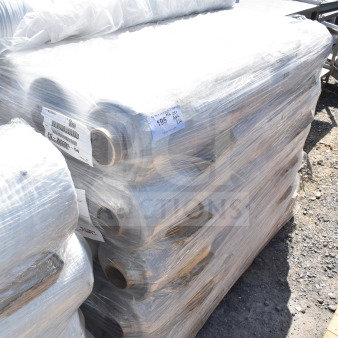 Stack of 26 FG-W0005-04 stretch film rolls on a pallet, labeled with product info and sealed in plastic wrap.