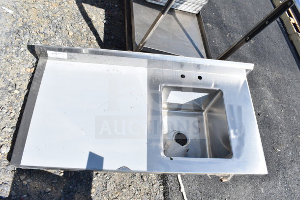 BRAND NEW Regency 600ST2448R 24"x48" stainless steel work table with right sink, faucet holes, no legs, scratch and dent condition.