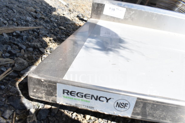 Brand new Regency 600ST2448R stainless steel work table, 24x48 inches, with right sink and faucet, no legs, NSF marked.
