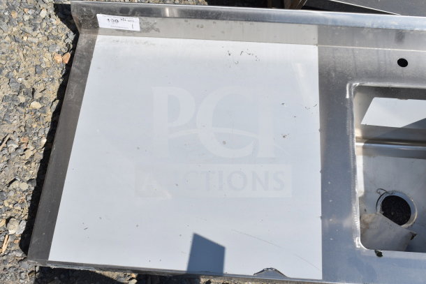 Regency 600ST2448R stainless steel work table with right sink and faucet, scratch and dent condition, no legs visible.