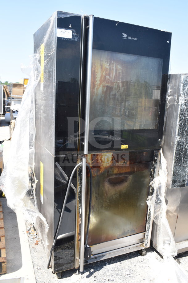 2 Fri-jado TDR7+7 P electric rotisserie ovens, 208V, 3 Phase, commercial use, visible wear, model labeled, outdoors.