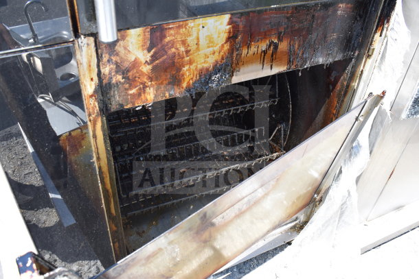 Fri-jado TDR7+7 P commercial electric rotisserie oven, used condition, visible wear and char marks on interior surfaces.