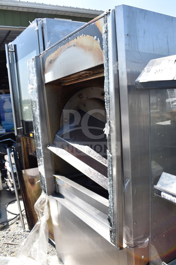 Commercial rotisserie oven, missing doors, stainless steel, visible wear and tear, ideal for parts or repair.