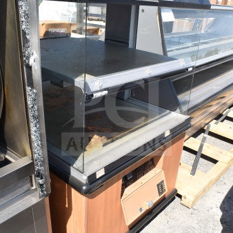 Custom Deli's Inc commercial heated display case merchandiser, 120/208 volts, 1 phase, glass panels, wood finish, visible wear.