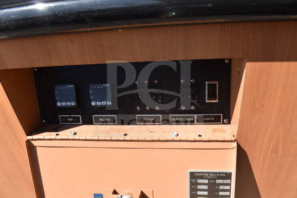 Custom Deli's Inc heated display case, 120/208V, 1 Phase, controls for power, quartz lamps, lights; used condition.