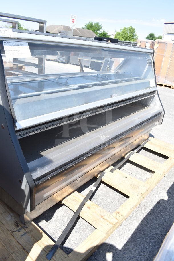 Commercial floor display case merchandiser, glass front, metal shelves, and visible allergy notice. Used condition.