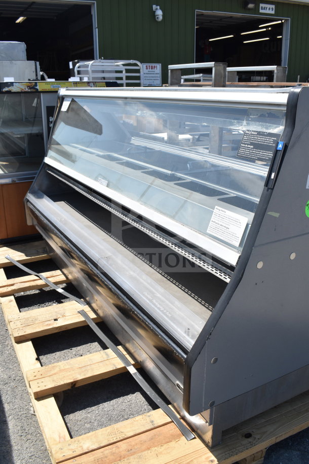 Commercial floor-style display case merchandiser with glass front, metal frame, and adjustable shelves. Good condition.