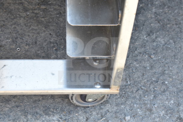 Commercial pan transport rack corner featuring sturdy metal construction and durable caster for easy mobility.