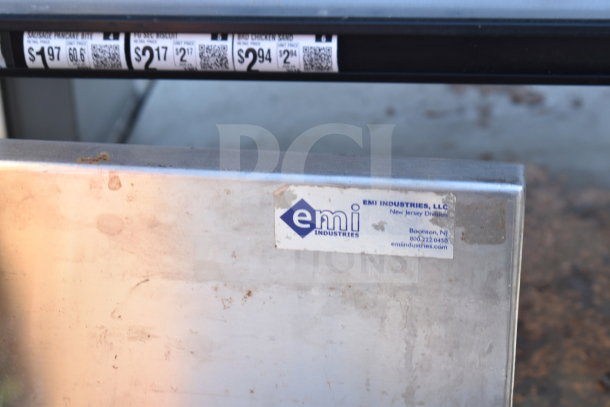 Metal counter by EMI Industries in used condition, visible label with company contact details.