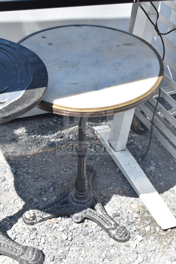 Set of three tables; one rectangular and two round. Round tables with wrought iron bases, mixed condition surfaces.