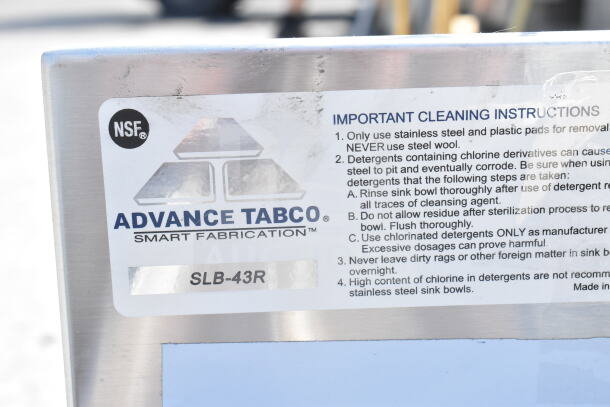 BRAND NEW Advance Tabco SLB-43R 48"x18" bar sink, three compartments, right-side drainboard, no legs, cleaning instructions label.
