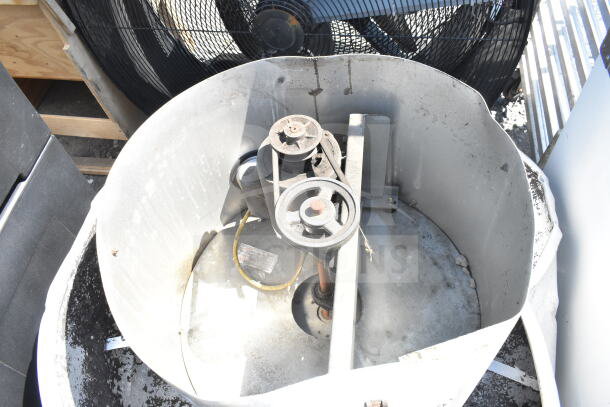 Commercial rooftop mushroom exhaust fan, used, 115/208-230V, 1 phase, visible wear, metal casing, belts, and pulley system.