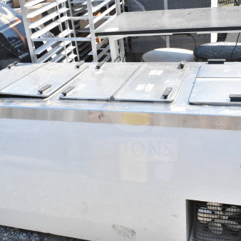 Master-Bilt commercial chest freezer, 115 volts, 1 phase, with metal exterior, four compartments. Visible brand label.