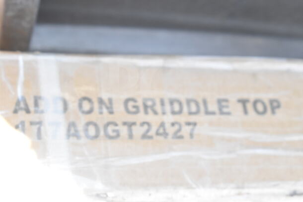 Brand new 177AOGT2427 add-on griddle top, 24" x 27" x 4", scratch and dent condition. Marking indicates model.