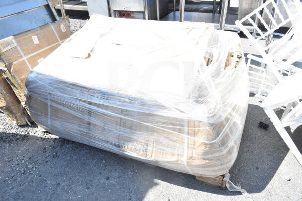 Pallet wrapped in plastic, contains 2 new items: 600UDT50R Regency 50" stainless dishtable and 24"x36" green epoxy shelf.