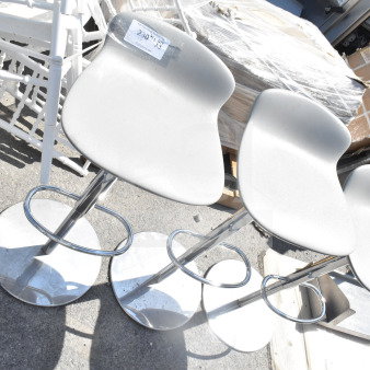 Three brand new low back stools with foot rests, slight scratch and dent condition, white seats, chrome bases.