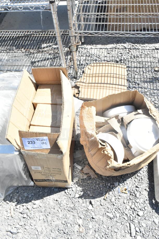 Cardboard boxes containing 303SCD16WH stackable raised rim bowls. Boxes show signs of wear. Auction label visible.