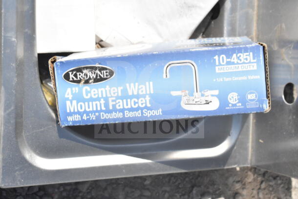 Krowne 4" center wall mount faucet box, medium duty, new condition, features double bend spout, ceramic valves.