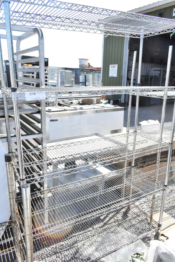 Chrome finish 5-tier wire shelving unit, sturdy design, buyer dismantle required, freight charges applicable.