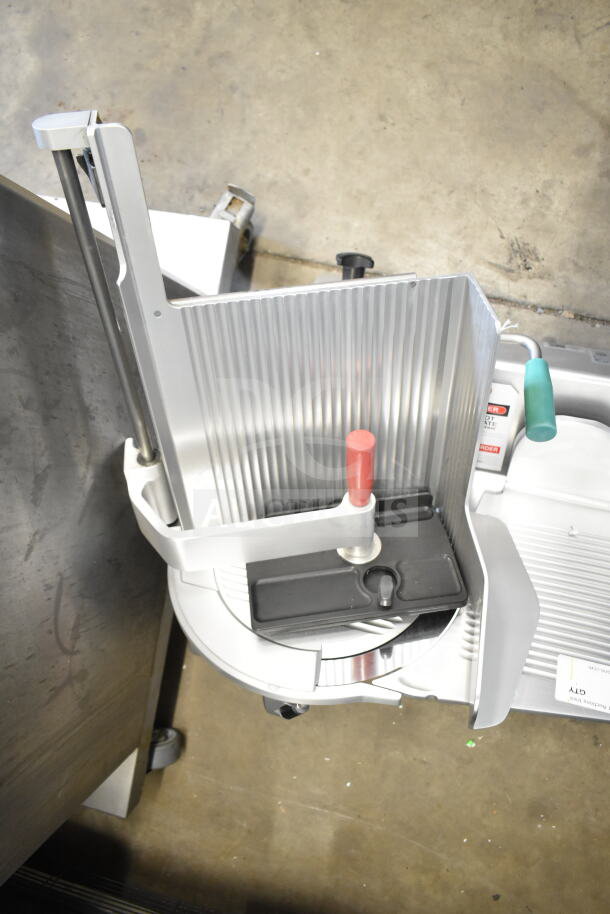 2018 Bizerba GSP HD commercial meat slicer, 120V, 1 phase. Features durable metal construction, safety handles, and adjustable thickness.
