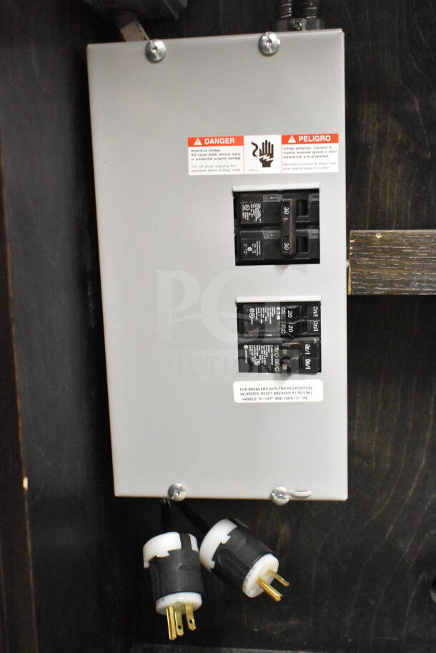 Portable bar with electrical panel, featuring multiple circuit breakers and power plugs. Condition appears operational.