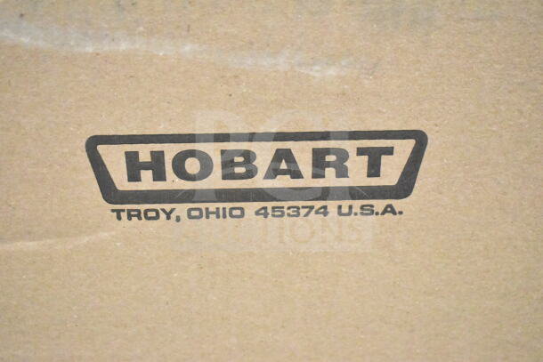 Cardboard box with Hobart logo and address, Troy, Ohio 45374, U.S.A., likely packaging for commercial scale model HTi-7LH4W.