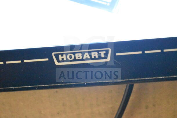 2020 Hobart HTi-7LH4W food portioning scale, screen damage visible, 120/208-240V, 1 phase, working condition, Hobart logo shown.