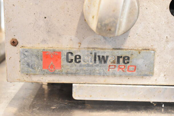 Cecilware Pro Commercial Gas Charbroiler Grill label, showing brand logo and aged surface, indicating prior use.