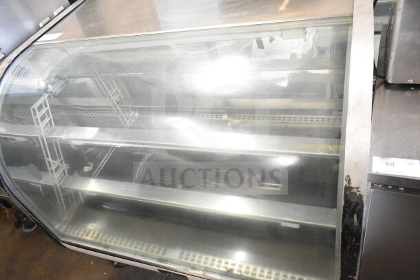 Delfield Commercial Floor Style Deli Display Case Merchandiser, glass front, metal shelves, used condition.