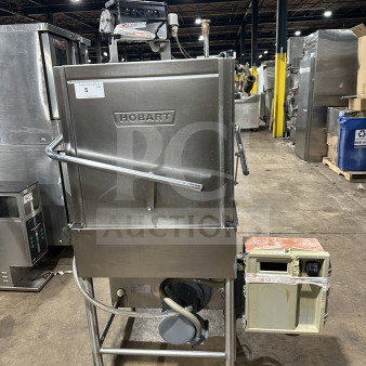 Hobart stainless steel commercial dishwasher, pass-through door-type, mounted on legs, shows model label and controls.
