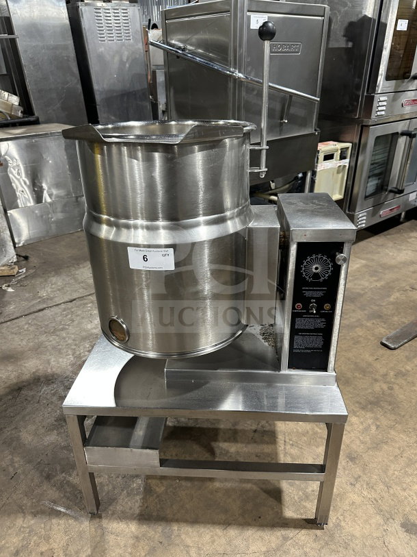 Wow Commercial stainless steel electric tilting steam-jacketed kettle on legs, features control panel, excellent condition.