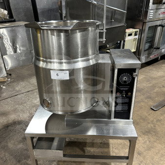 Wow Commercial stainless steel electric tilting steam-jacketed kettle on legs, features control panel, excellent condition.