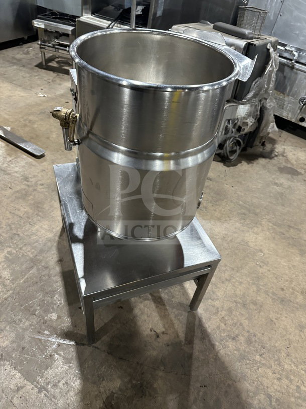 Wow commercial stainless steel electric tilting steam-jacketed kettle on legs, excellent condition, durable construction.