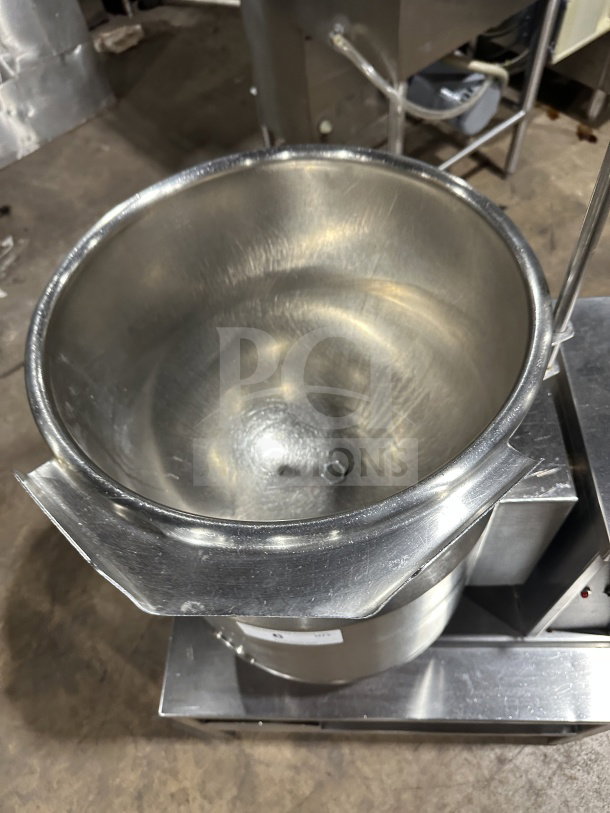 Commercial stainless steel electric tilting steam-jacketed kettle on legs, excellent condition, ideal for high-volume cooking.