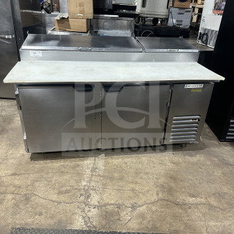 Beverage Air DP67HC 67" stainless steel 2-door refrigerated pizza prep table, cutting board, poly coated rack, on casters.