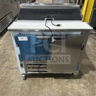 CoolTech Lowboy/Worktop 2-Door Sandwich/Salad Prep Table, Model CUST368M, on casters, with poly-coated rack and 120V plug.
