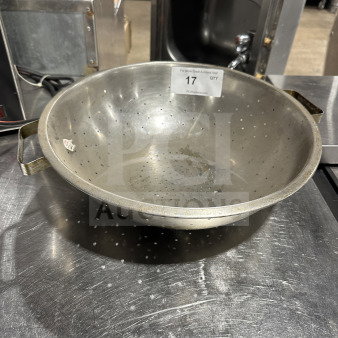 Heavy-duty stainless steel colander bowl with handles, commercial-grade, durable with perforated holes. Auction tag labeled "17".