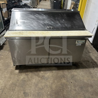 Avantco 178SCLM260 stainless steel refrigerated prep table with cutting board, on casters, used condition, visible branding.