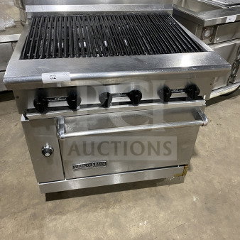 American Range stainless steel 6-burner gas charbroiler with oven base, commercial-grade, on legs, well-maintained.