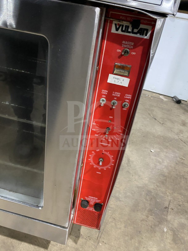 Vulcan commercial oven with red control panel, featuring master switch, thermostat, and timer. Good condition, visible markings.