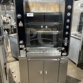 Rotisol 9505 commercial rotisserie oven; stainless steel, tempered glass doors, retractable workstation, enclosed cabinet base, on casters.