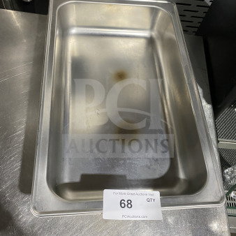 Commercial stainless steel full-size hotel pan, used condition, slight discoloration inside. Auction tag No. 68 visible.