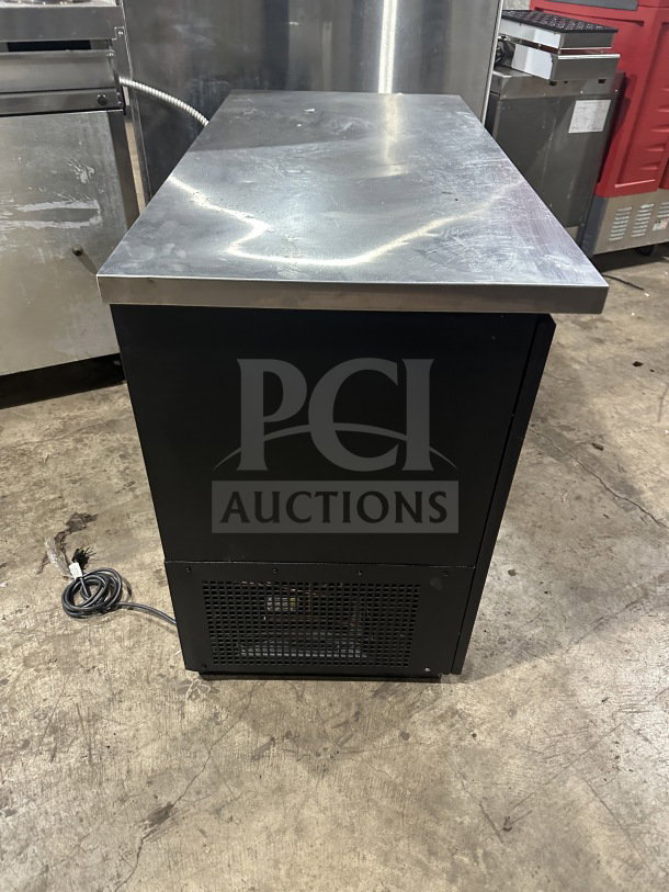 True TBB2448GSDLD commercial stainless steel refrigerated beer back with sliding glass doors and worktop, poly-coated rack.